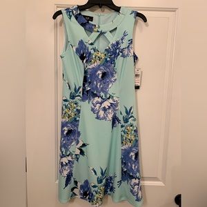 AGB brand sleeveless aqua dress with flowers. Cut out collar.  Size 6.  NWT.